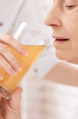 elderly-woman-drinking-juice-hospital 2 Live-In Services