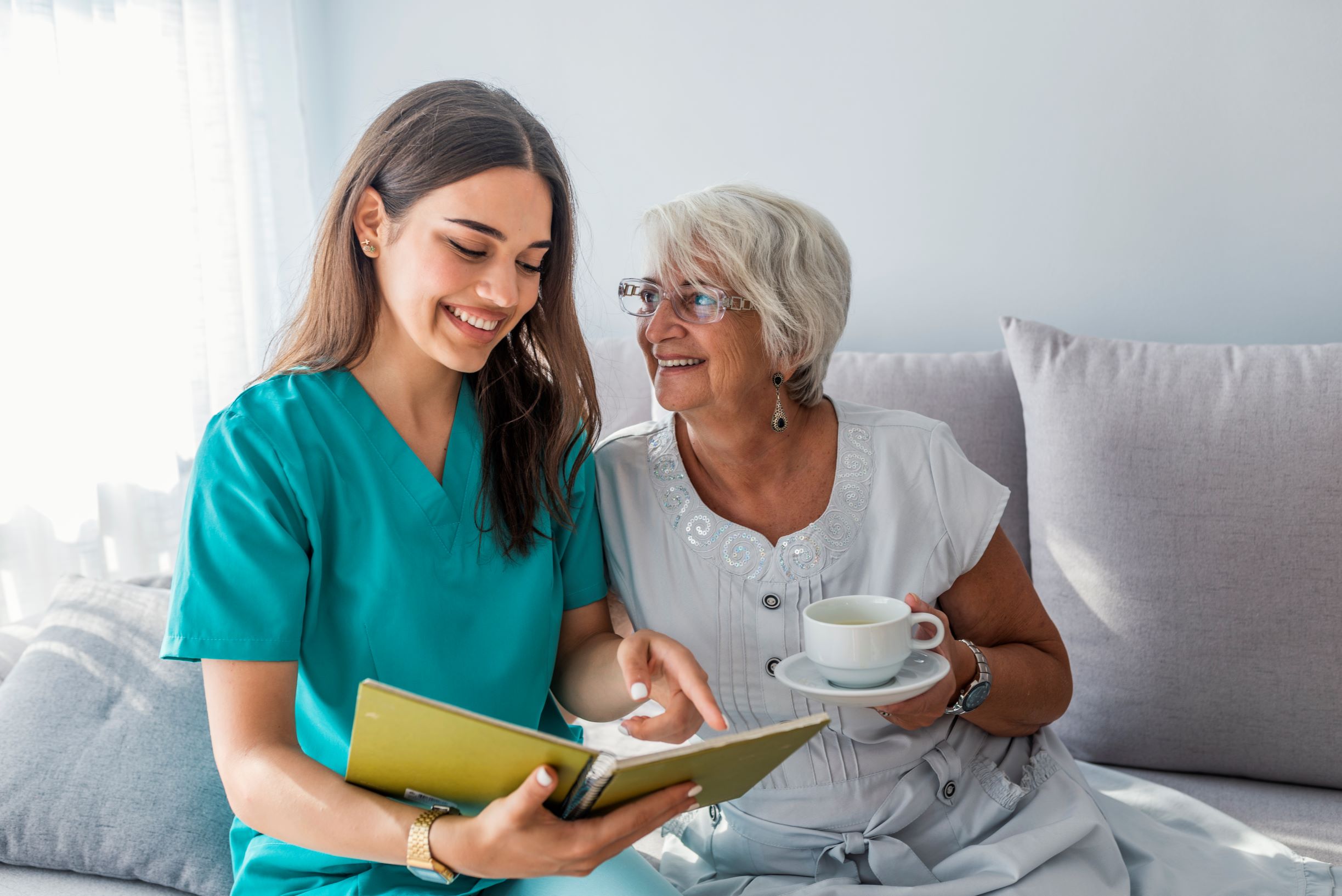 happy-patient-is-holding-caregiver-hand-while-spending-time-together happy-patient-is-holding-caregiver-hand-while-spending-time-together